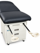 Examination table with patient footrest